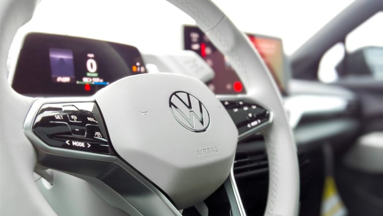 A WHITE VOLKSWAGEN STEERING WHEEL