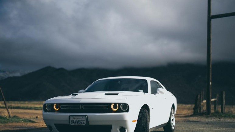 WHITE DODGE CHARGER ON THE ROAD