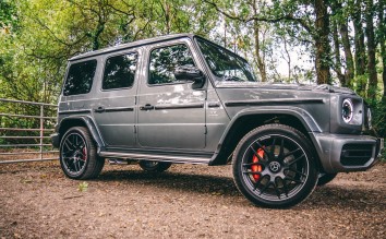 MERCEDES-BENZ G CLASS PARKED ON DIRT ROAD