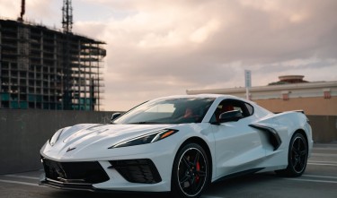 CHEVROLET CORVETTE ON PARKING LOT ON ROOF