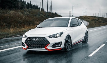 PHOTO OF WHITE CAR ON WET ROAD HYUNDAI