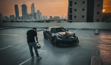 MAN FILMING CHEVROLET CORVETTE