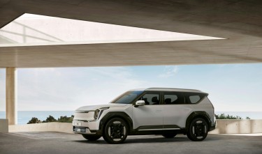 WHITE CAR UNDER A MODERN ROOF