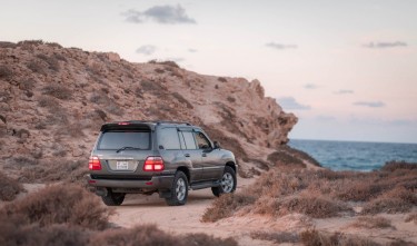 TOYOTA LAND CRUISER ON A SEASIDE CLIFF