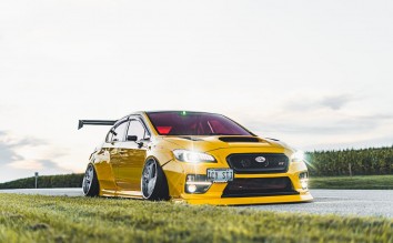 YELLOW  SUBARU ON THE ROAD 