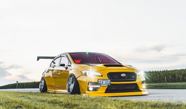 YELLOW  SUBARU ON THE ROAD 