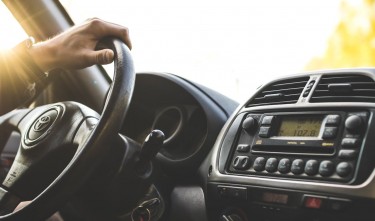 PERSON DRIVING A CAR TOYOTA