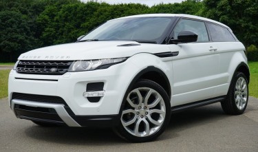 WHITE LAND ROVER RANGE ROVER SUV ON ROAD