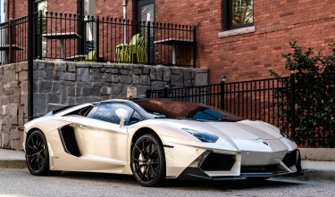 WHITE LAMBORGHINI PARKED ON THE ROAD 