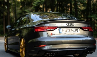 BLACK SEDAN CAR PARKED ON A CONCRETE ROAD AUDI S3