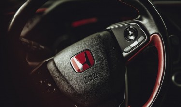 BLACK AND RED HONDA STEERING WHEEL