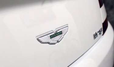 CLOSE UP SHOT OF A CAR LOGO ASTON MARTIN