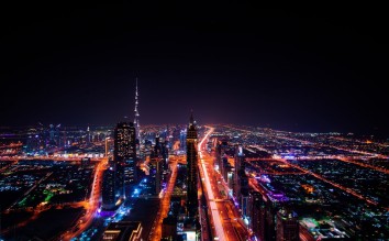 HIGHRISE BUILDINGS DURING NIGHT TIME PHOTO