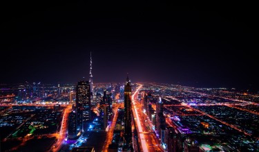 HIGHRISE BUILDINGS DURING NIGHT TIME PHOTO