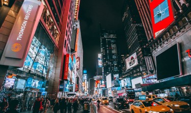 CROWD OF PEOPLE ON STREET DURING NIGHT TIME