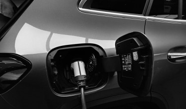 MONOCHROME PHOTO  OF HYBRID CAR CHARGING