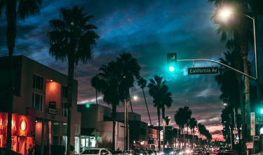 BUSY STREET IN TROPICA TOWN AT NIGHT