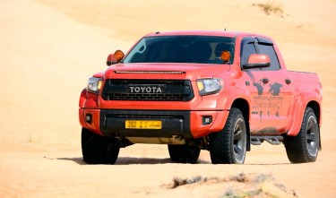 A PICKUP TRUCK ON THE DESERT TOYOTA