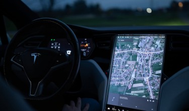 VIEW OF TABLET SHOWING THE MAP IN A TESLA