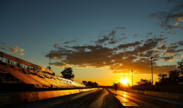 BLACK TOP ROAD DURING SUNSET