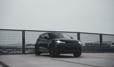 LAND ROVER PARKED ON ROOFTOP PARKING LOT