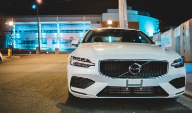 PHOTO OF WHITE CAR PARKED ON ROADSIDE VOLVO