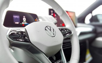 A WHITE VOLKSWAGEN STEERING WHEEL