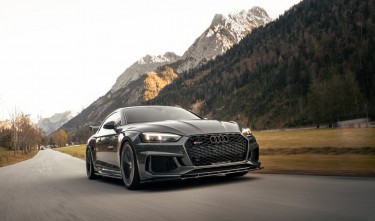 Black Audi on Road Near Mountain