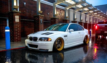 A PARKED WHITE BMW 