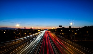 LIGHT TRAILS FROM CARS DRIVING ON THE ROAD