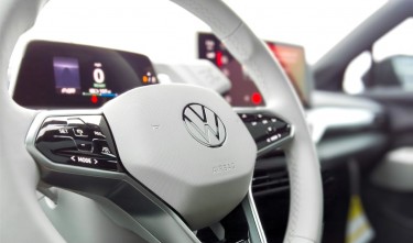 A WHITE VOLKSWAGEN STEERING WHEEL