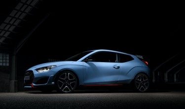 HYUNDAI VELOSTER PARKED IN A DARK ROOM