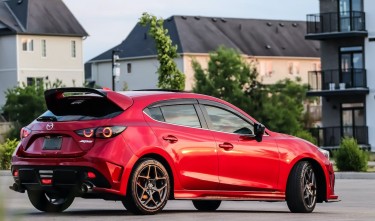 BACK VIEW OF RED MAZDA