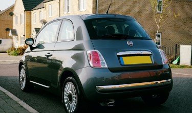 A HATCHBACK CAR PARKED ON THE STREET