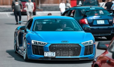 MAN DRIVING BLUE AUDI R8 ON  STREET 