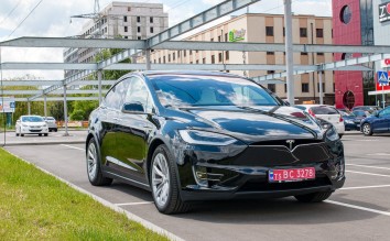 TESLA PARKED BLACK VEHICLE 