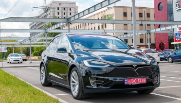 TESLA PARKED BLACK VEHICLE 