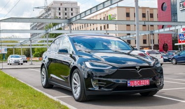 TESLA PARKED BLACK VEHICLE 