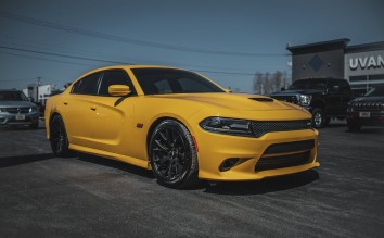 A PARKED YELLOW DODGE CHARGER 